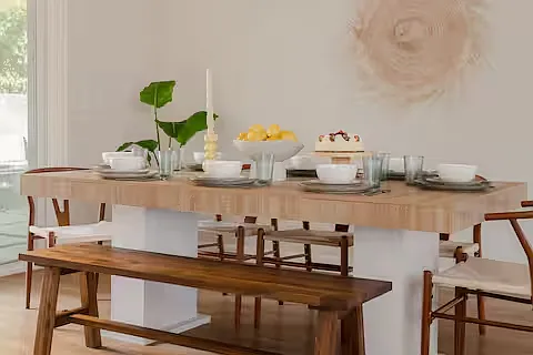Bright, modern dining space with a warm wooden table and chairs, filled with natural light_perfect for cozy meals or entertaining in style.