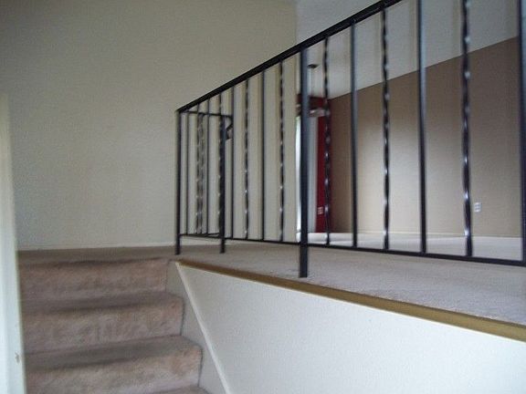 Entry to split-level home with view of living room on right