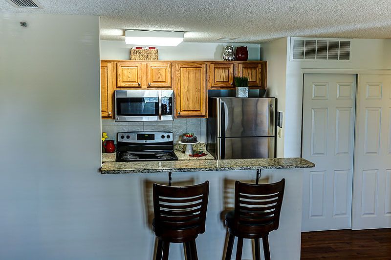 Convenient Bar Opens into Kitchen