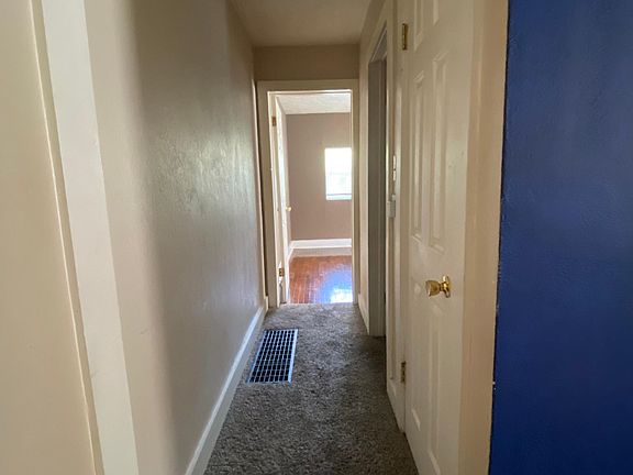 Hallway leading to bathroom and bedroom