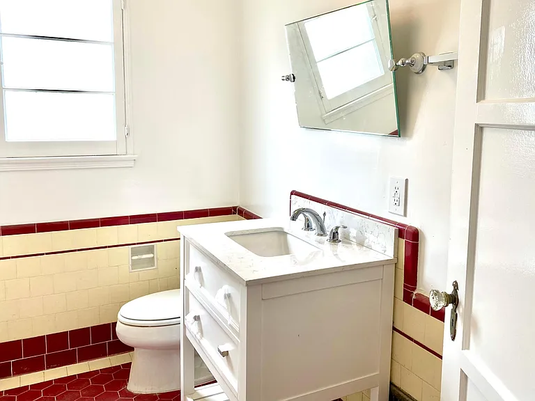 bathroom with new sink, toilet and mirror