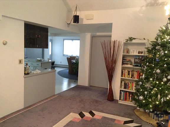 Dining room in the far back, Kitchen to the left, Bedroom door in the middle picture, Livingroom has a custom sculptured wall to wall carpet