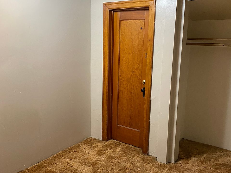 Bedroom with secured, back exit to laundry facility. Closet for storage space.