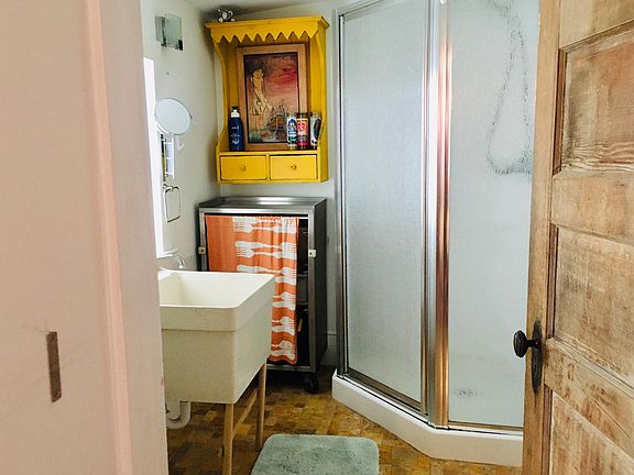 We took out this utility sink and replaced it with a new ceramic one. The floor is quarried tile.