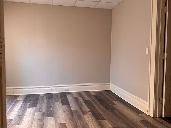 living room from kitchen.. bathroom door on right