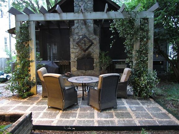 Screen porch/2 sided fireplace exterior with sitting hearth