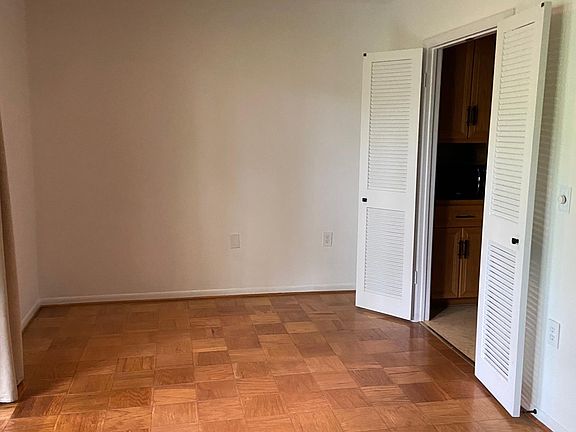 Dining are off living room, also opening onto a deck, doorway into kitchen.