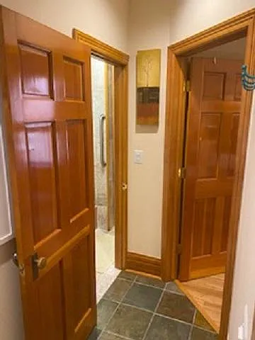 Hallway between kitchen, bedroom and bath