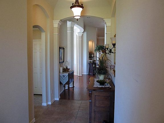 Fantastic architectural features! Large foyer features high ceilings, upgraded tile flooring and lighting and and arched entryways,