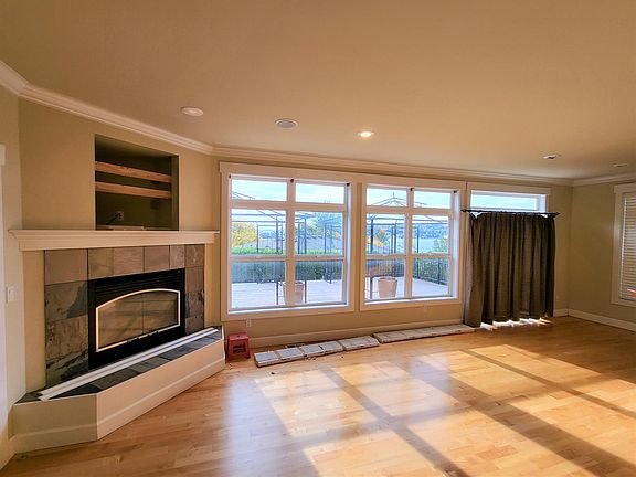 Gas Fireplace with open view of the Lake from Kitchen and Living room