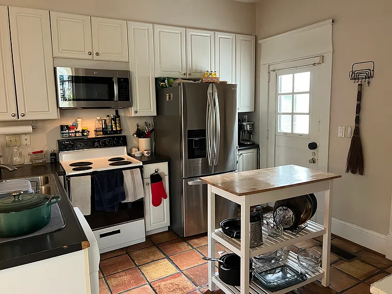 kitchen with back door to large deck and off street parking
