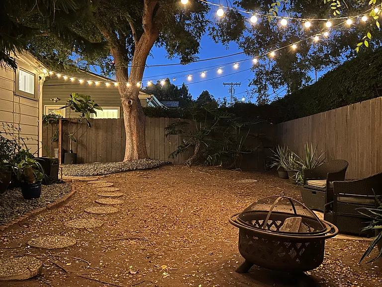 Dreamy side yard at night... Perfect for a summer evening soiree!
