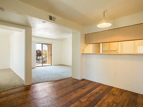 Open living area with rich wood vinyl plank flooring