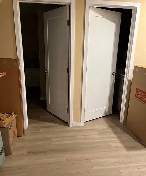 View from front door. Left door main bedroom, right door bathroom.