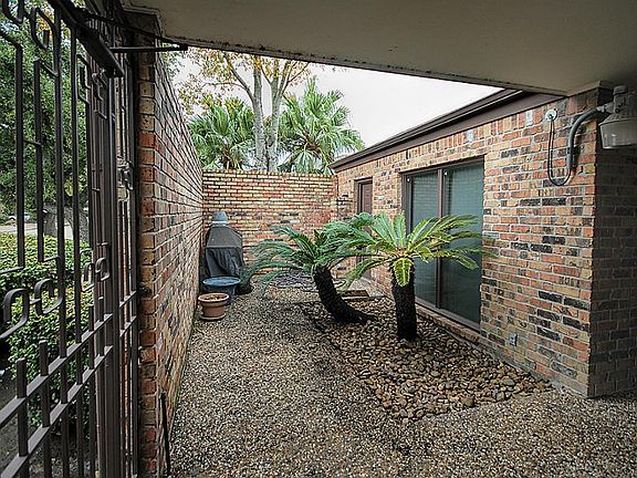 Spacious front patio with gas hook-up for Barbeque Grill.