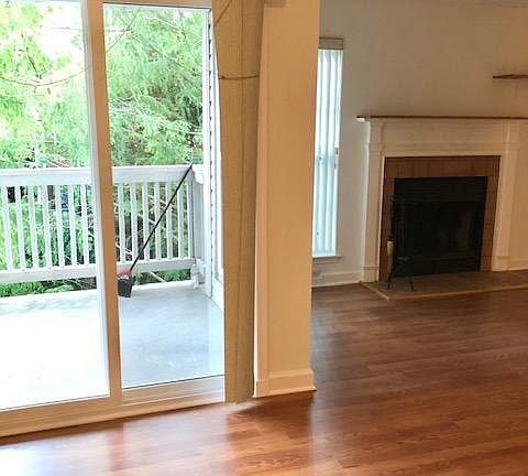 Living room with balcony and fire place