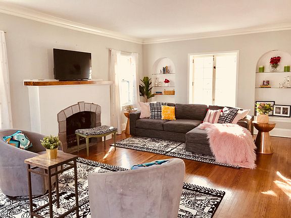 This room has windows facing East, West, and South.