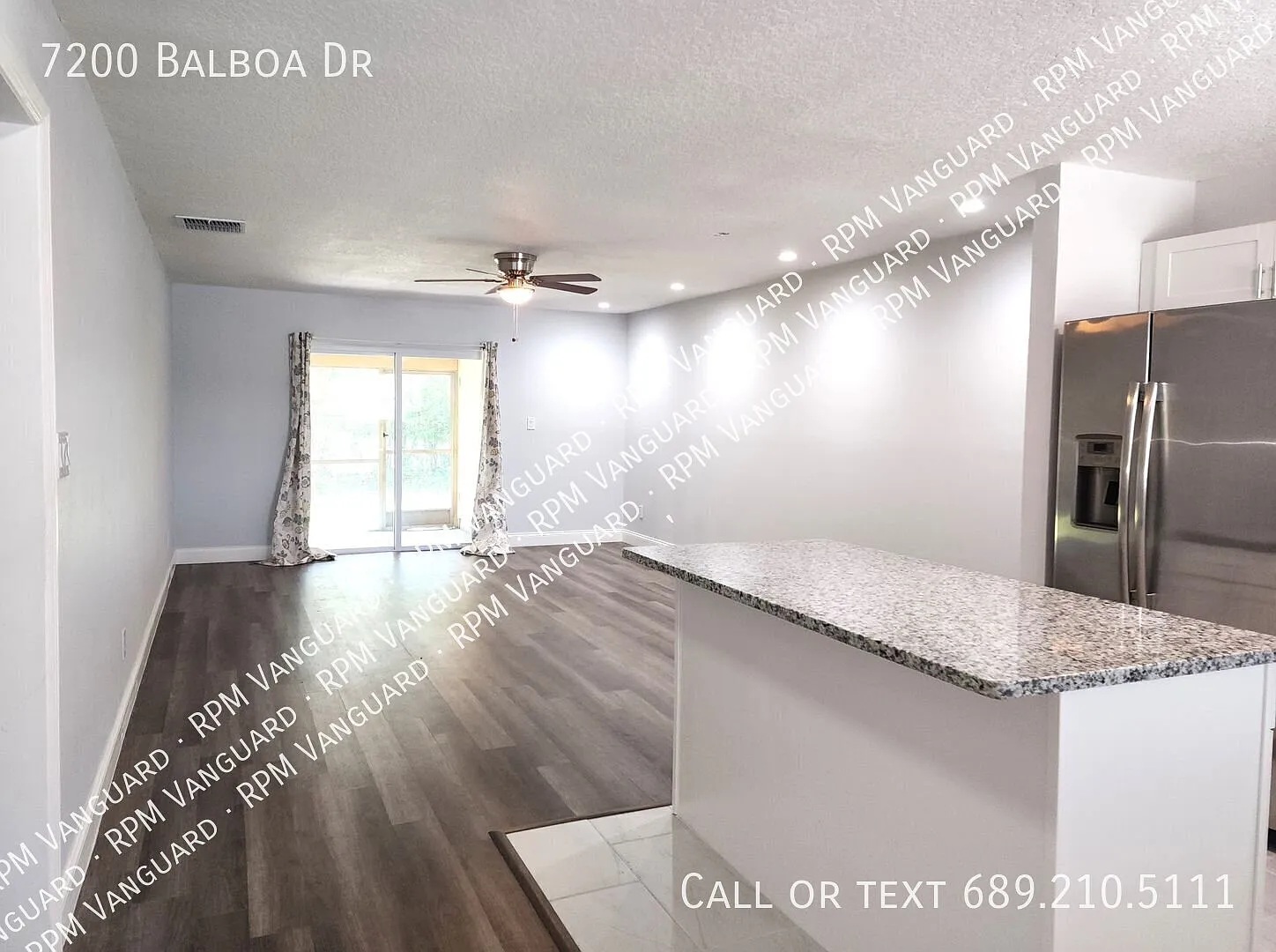 Ground Floor End Unit Condo with Open Floor Plan and Screened Patio; Water Included — Photo 3