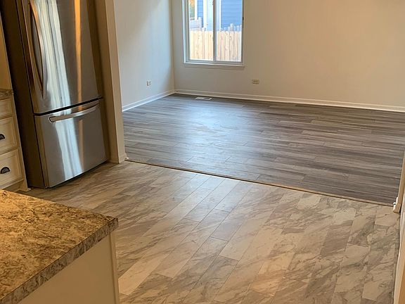 kitchen leading into spacious family room