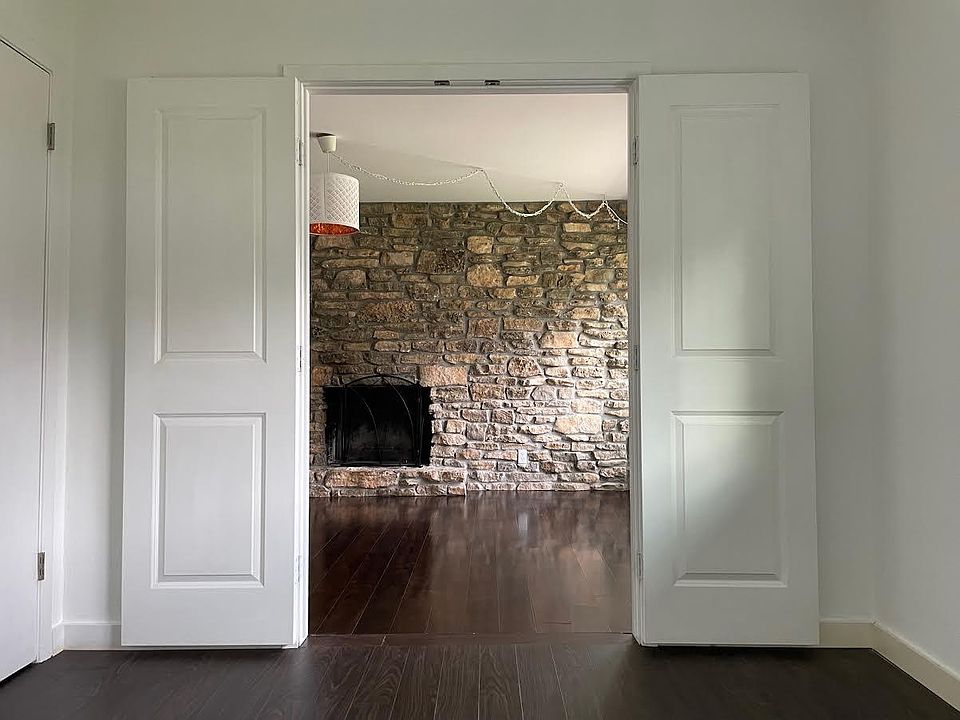 Office or studio space opens onto living room and fireplace