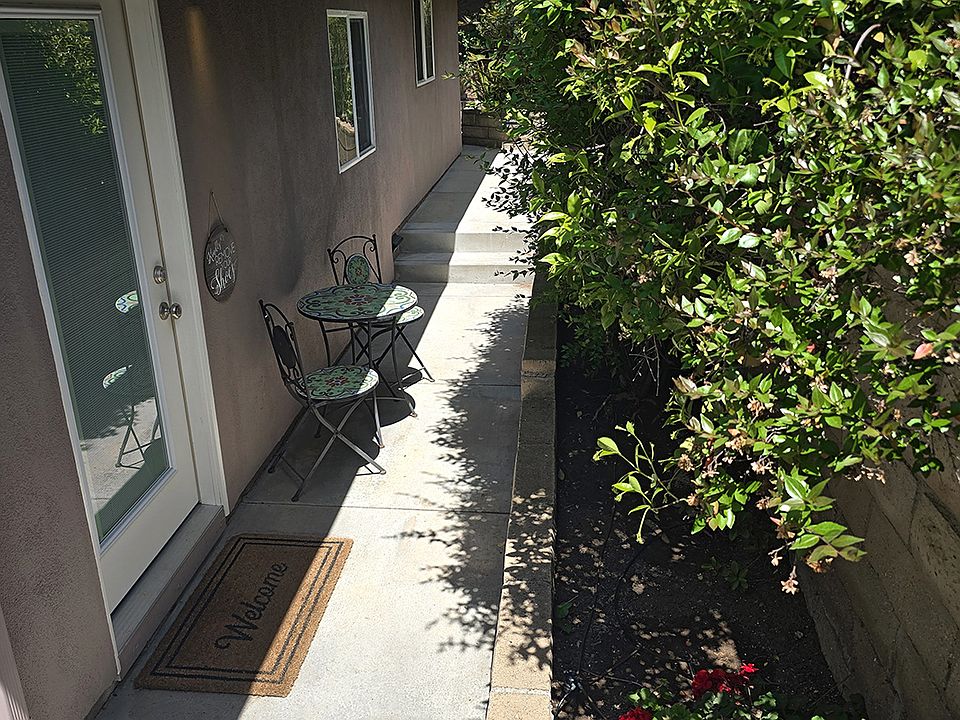 Gated private entrance and cafe table seating.