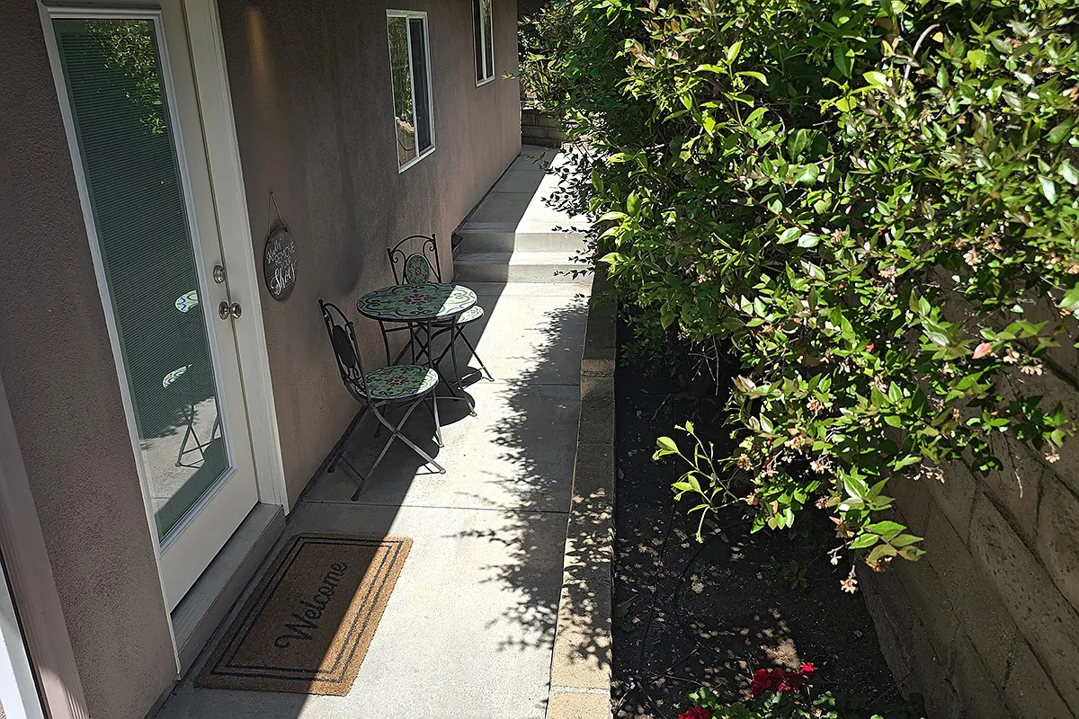 Gated private entrance and cafe table seating. - 73 Summerfield St #A