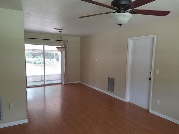 Large living room opens to screened patio