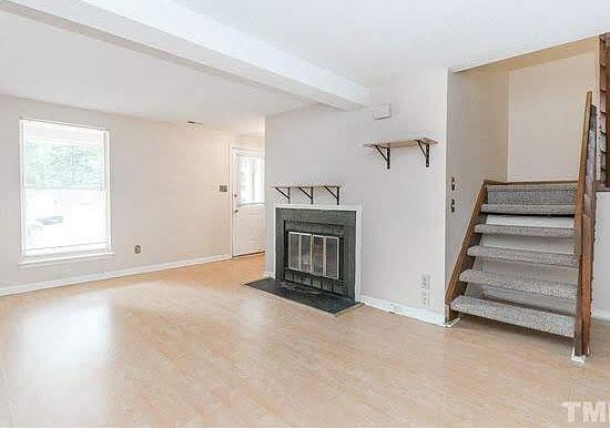 Living room with steps leading upstairs