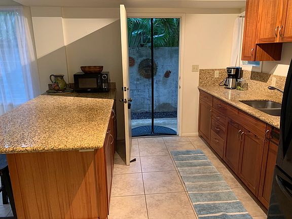 Kitchenette with door to courtyard entryway