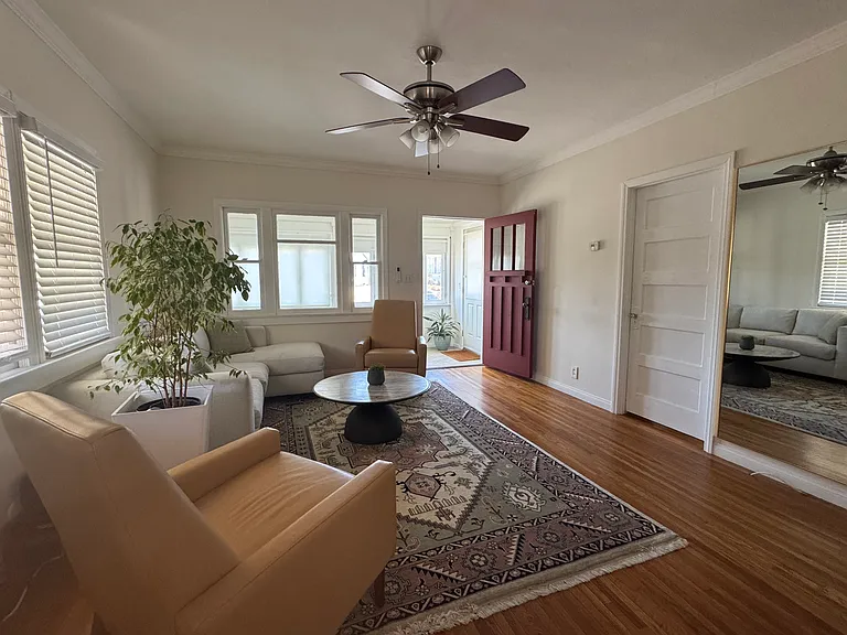 Original craftsman door, bedroom doors and glass knobs. Warm, original wood floors. Crown molding.
