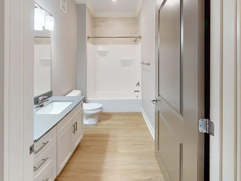 The main bathroom includes an extra large vanity with drawer space. The main bathroom includes an extra large vanity with drawer space.