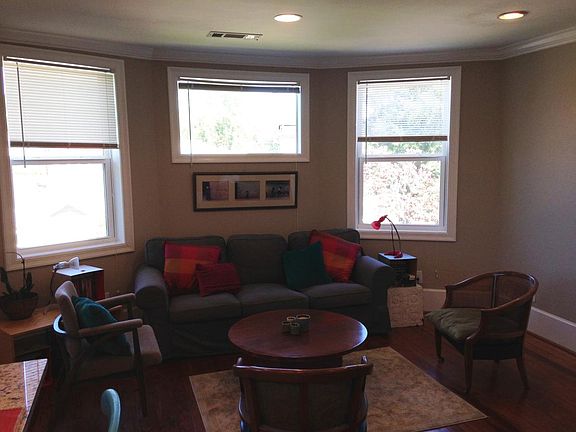 Living room w/ original hardwood floors