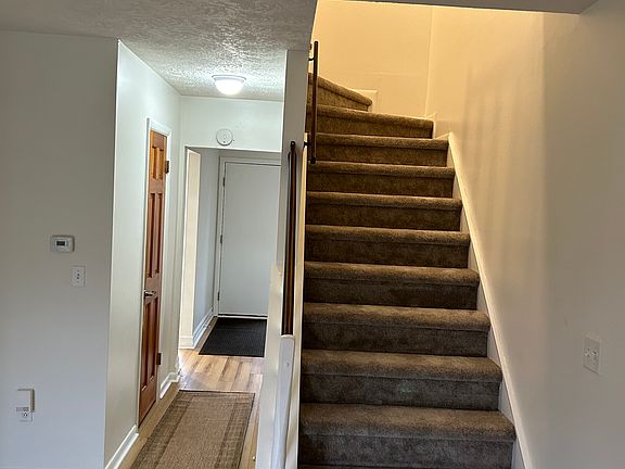 Staircase to bedrooms. Recently re-carpeted.