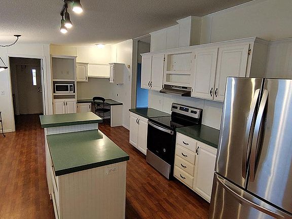 Also features separate laundry area and walk in pantry not shown here. Also corner built in desk. Nearly new whirlpool washer and dryer. included.