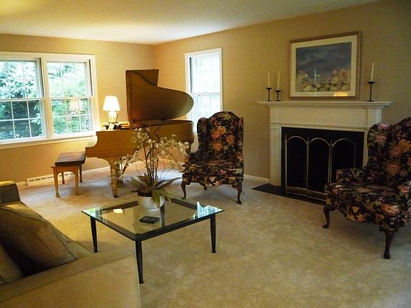 Love the elegant fireplace in the Living Room