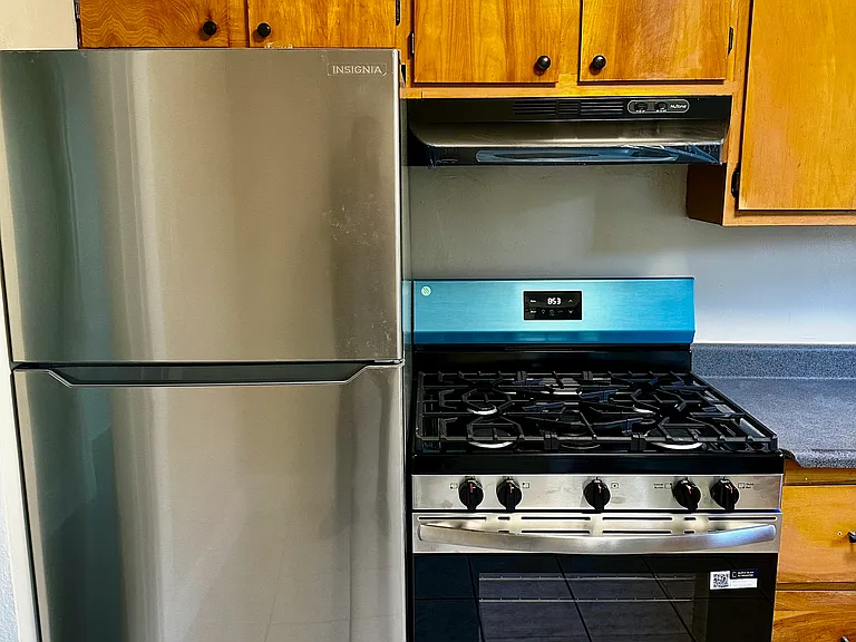 Brand new stainless steel refridgerator, stove oven, and range hood included.