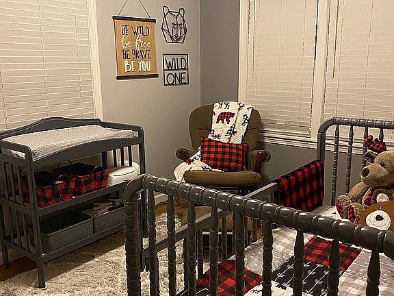 Bedroom with hardwood floor.