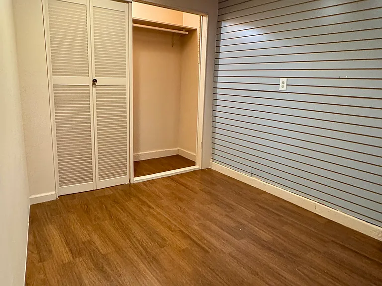 Storage space with a spacious wardrobe.
