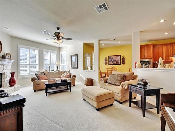Large formal living space with stone fireplace.