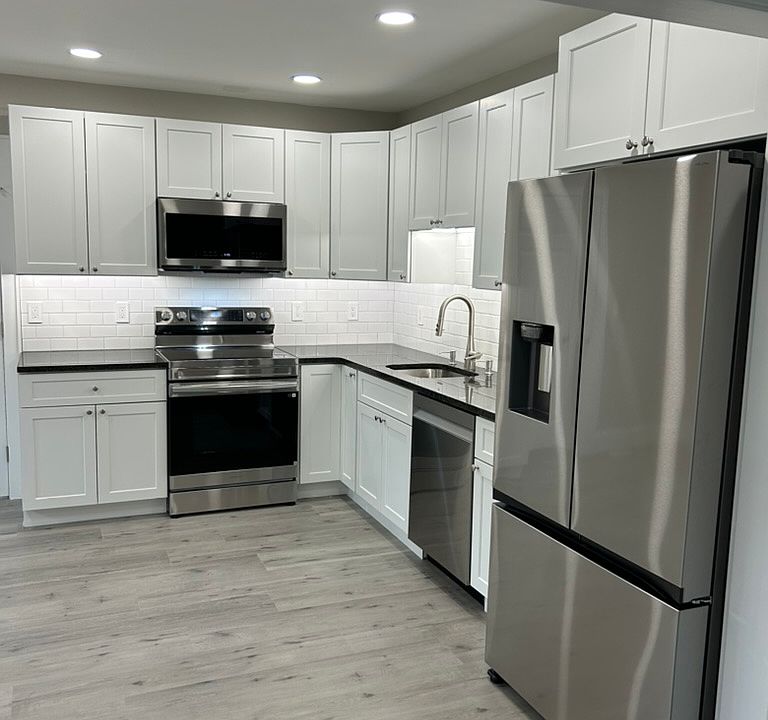 New range, new microwave, granite countertop, New flooring, Under-cabinet dimmable lighting.