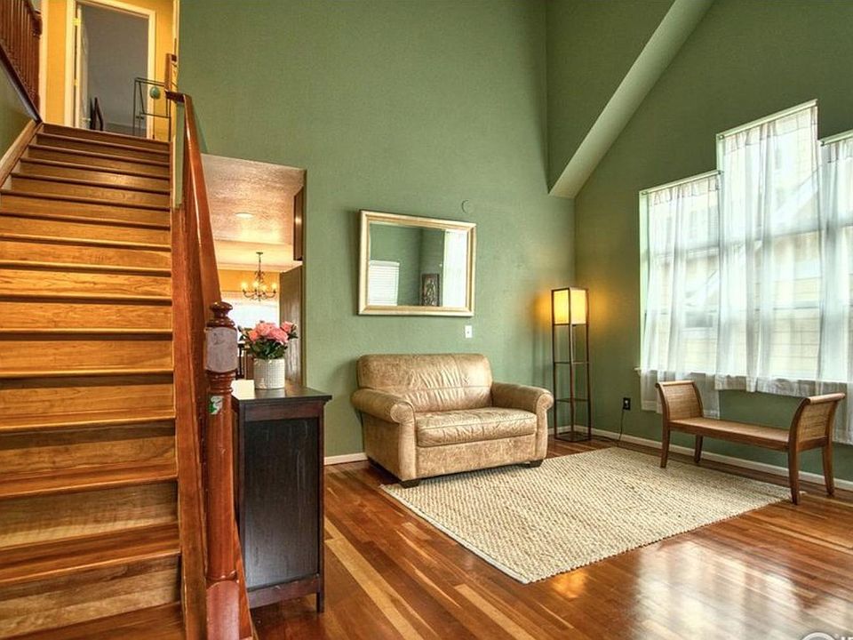 Lovely sunny high-ceilinged entry room for library, music, reading, play.