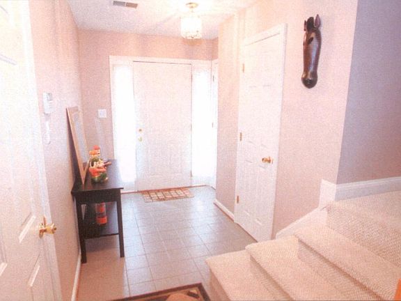 Entry hallway first floor with half bath
