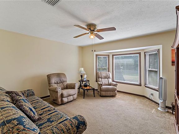Formal dining room or study/den with bay window and french door to living room