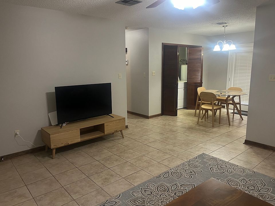 Living Room - Dining Room Table w/laundry area