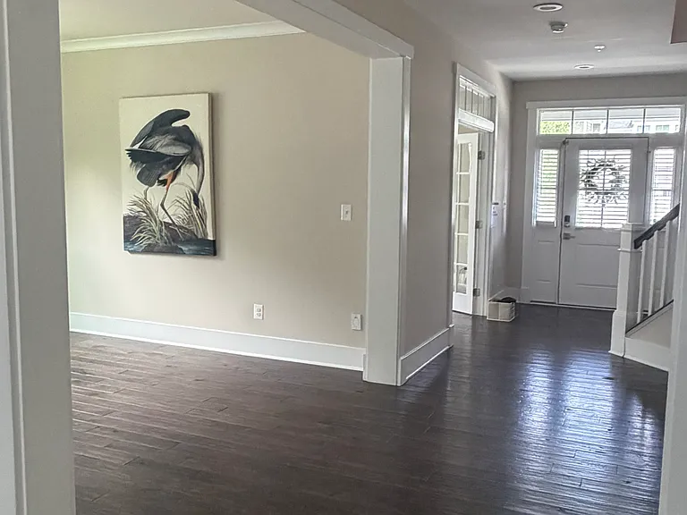 View of the spacious foyer from the kitchen, showcasing the home's open and inviting layout.