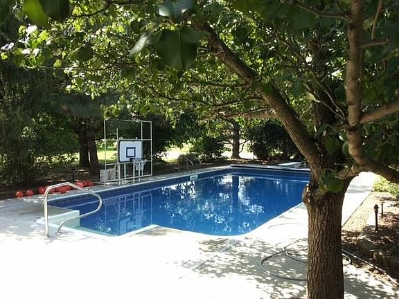 This is a summer view of 18x36 inground pool with automatic cleaner and covers.  Liner aprox. 5 years.  Pool pump 1 year and 500 lb sand filter 1 year.