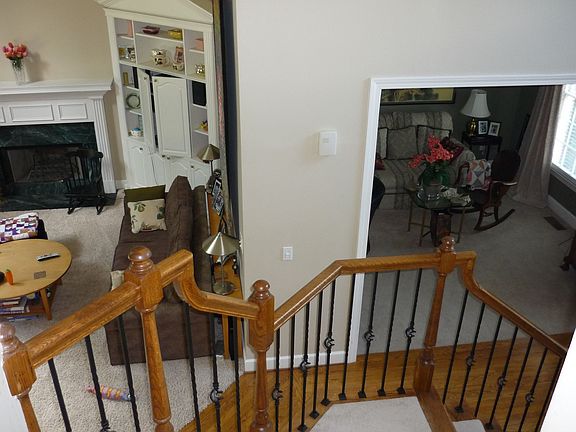 Elegant view; two story foyer, den and separate LV Rm