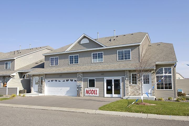 Brick tailored, maintenance free ext with private patio and large yard.