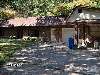Showing carport beside garage