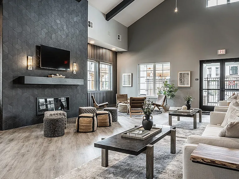 The Nese clubhouse includes a cozy lounge for residents to relax, read, play games, or gather with friends and neighbors.